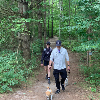 My husband and me hiking with our two dogs