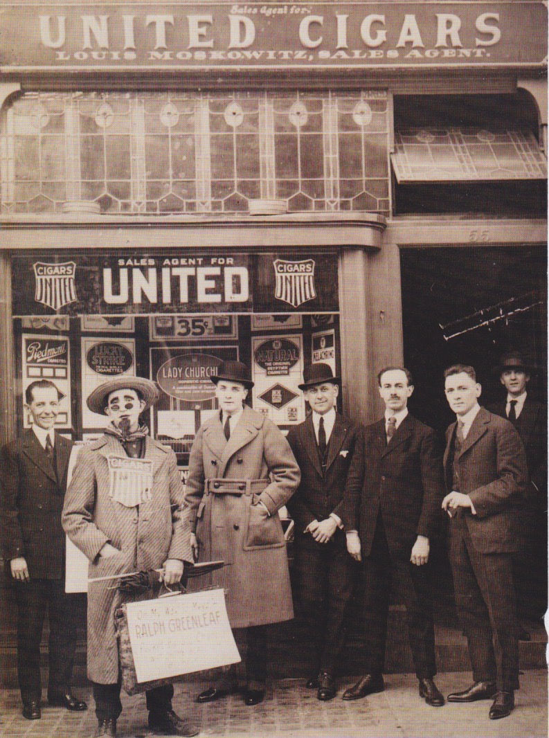 Men standing in front of a United Cigar Store.