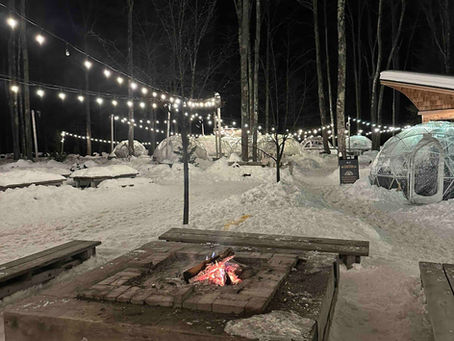 Igloos and string lights in the snow