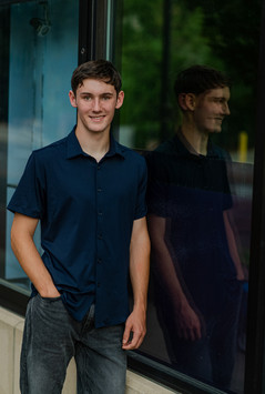 boy with reflection in window