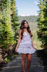 girl in dress in colorado forest