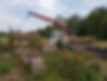 Crane truck lifting pipes