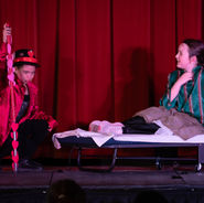 Young performers in costume acting on stage during a Montreal Children’s Theatre production.
