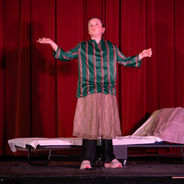 Young actor performing a solo scene on stage at Montreal Children’s Theatre.