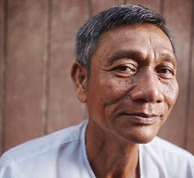 asian-old-man-looking-at-camera-against-