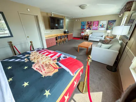 Family-friendly movie room featuring plenty of space, a king bed, and a comfortable sofa bed at Super 8 Edmonton South.