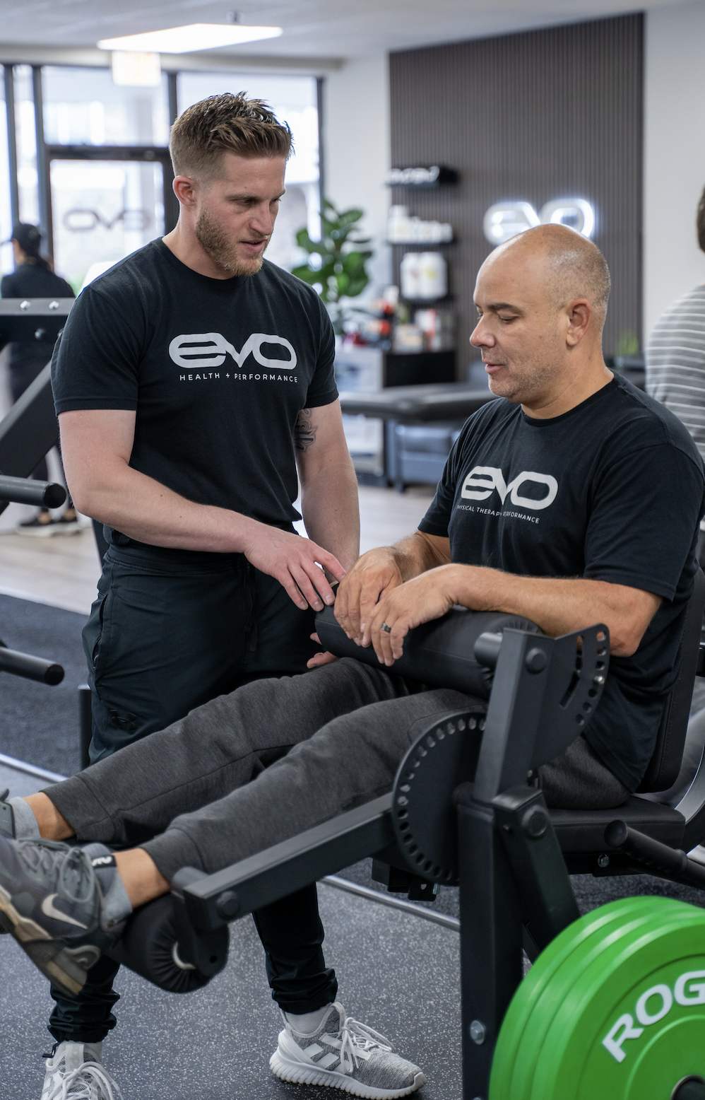 Physical therapist working through knee rehab with a patient