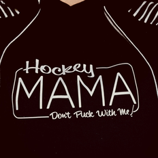 Erin Parsons Designs created this sweater design with saying "Hockey mama, don't puck with me"