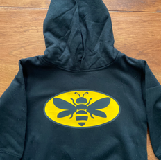 Erin Parsons Designs created this sweater with a custom designed logo for a beekeeper's son who loves Batman