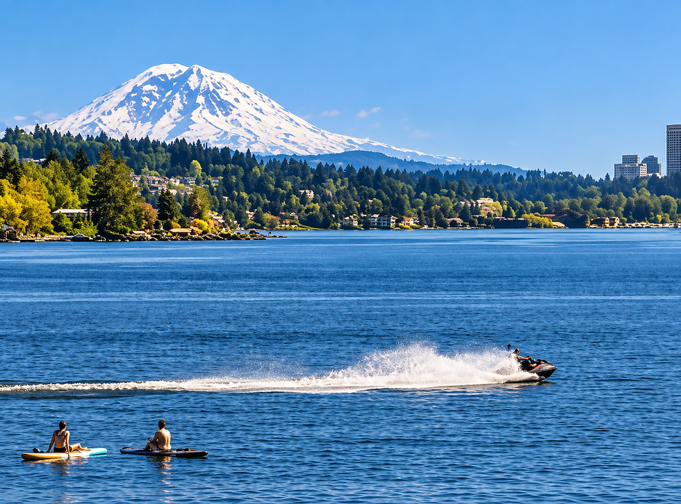 Paddleboarders and a jet ski enjoy the sparkling waters of Lake Washington, with breathtaking mountain views and the lush greenery of Kirkland's Finn Hill and Juanita neighborhoods in the background. 🏞️🌊