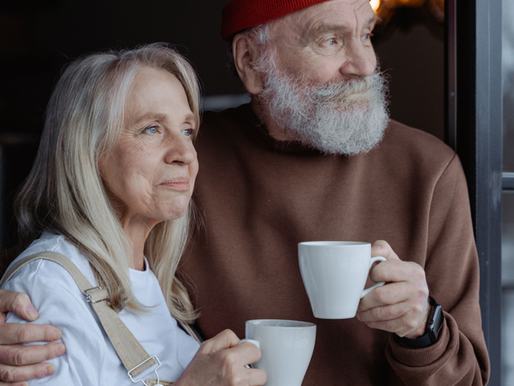 Older couple enjoying a quiet moment together at home during the empty nest transition