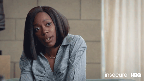 Black female therapist nodding her head.