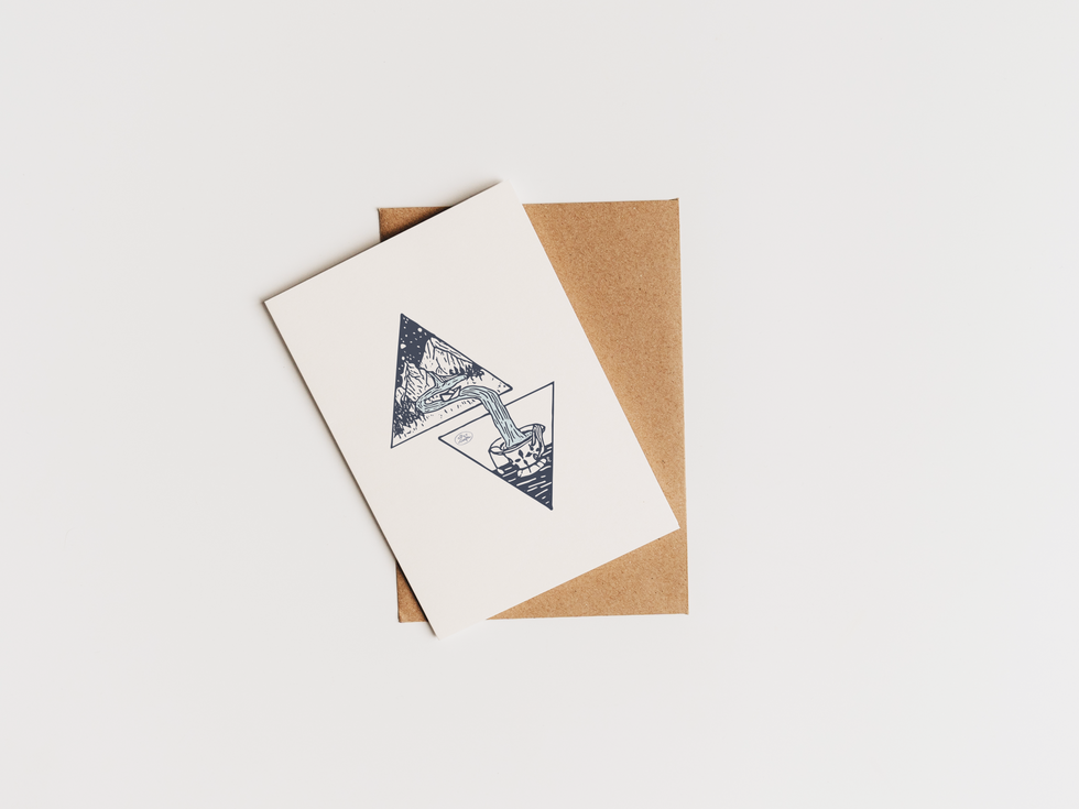 Inked origami boat in teacup - geometric