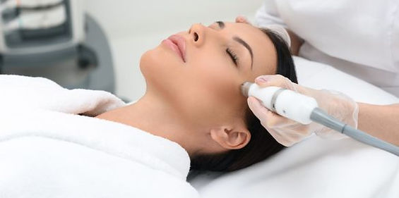 Cosmetologist makes mesotherapy injection for rejuvenation woman face