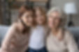 Happy little girl child with young mother and old grandmother