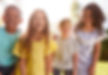 Portrait Of Smiling Children Outdoors At Home Looking Into Camera