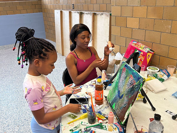 Youth at Gamble Recreation Center painting during After School Camp