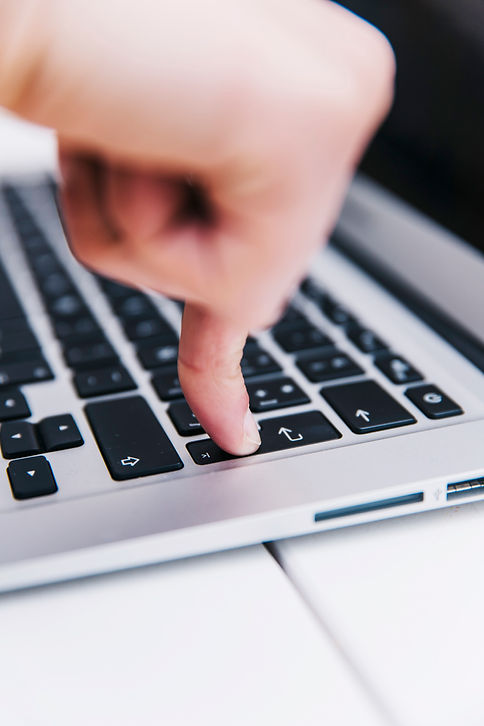 person-pressing-enter-key.jpg