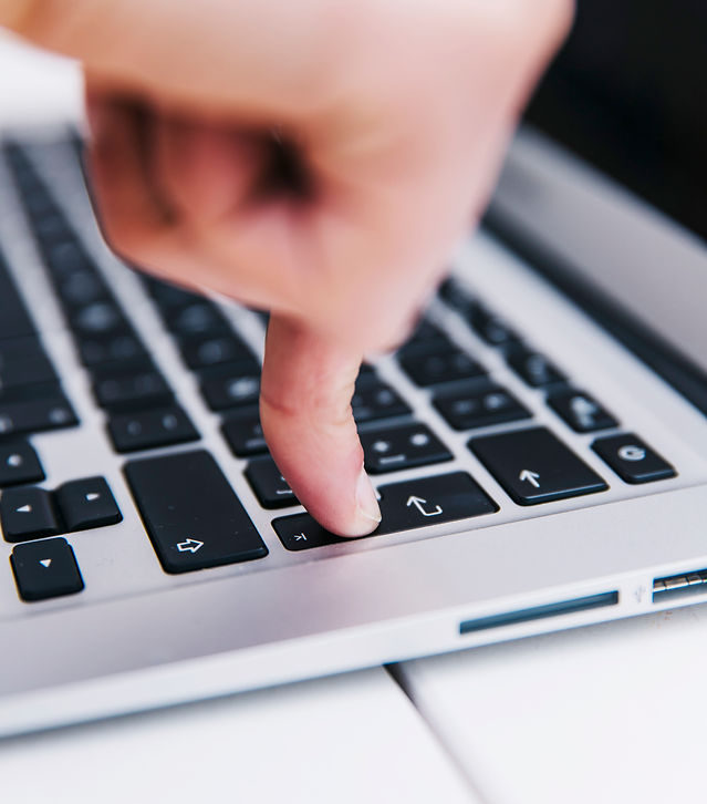person-pressing-enter-key.jpg