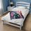 Thumbnail: Teal robot on a soft blanket