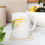 Thumbnail: White mug with colorful butterfly design
