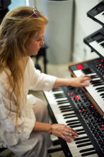 Madhavi at the keyboards in production mode at Spotted Peccary Music NW.