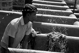 Boy Washing Clothes