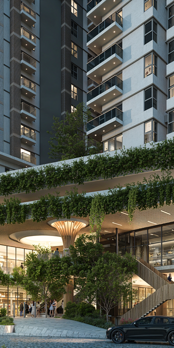 Modern apartment building entrance with lush landscaping