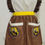 Thumbnail: Hufflepuff Ruffle Apron-Filigree and Crested Pocket