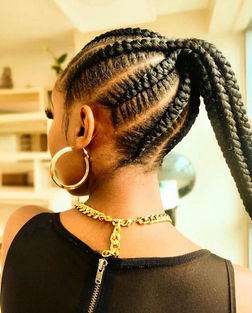A beautiful picture of a lady in cornrows