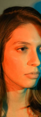Portrait photograph of woman with red and green lighting, by Alyssa Spatola