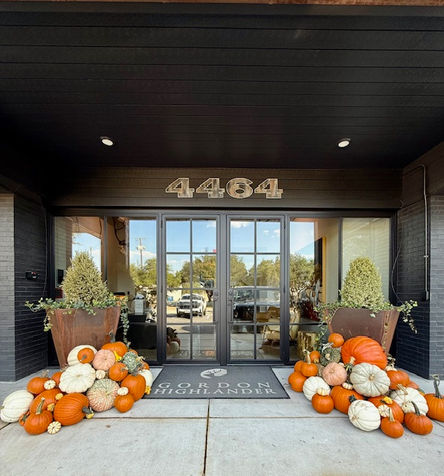 Business entryway in Dallas, Texas with an array of pumpkins arranged by My Front Porch to celebrate the fall season.
