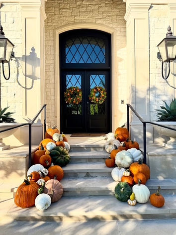 Elegant autumn porch decor featuring orange, white pumpkins in University Park, TX.