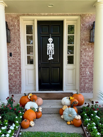 Elegant pumpkin porch decorating with white and heirloom pumpkins in Plano, TX.