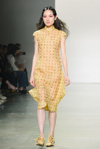 A female model modeling a dress look designed by SISIO