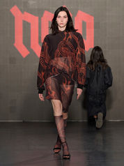 runway model in black and red