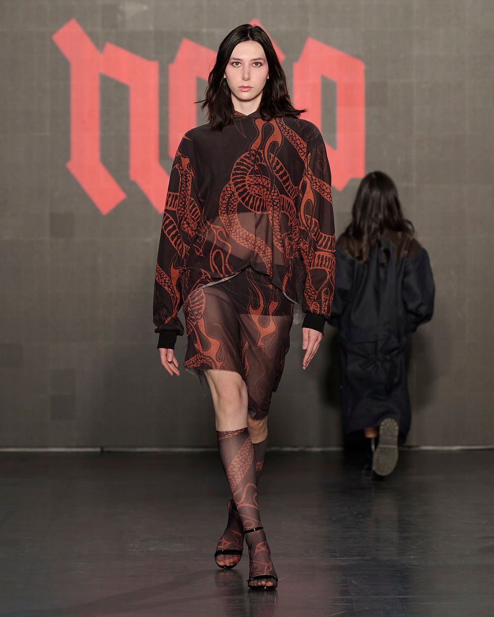 runway model in black and red