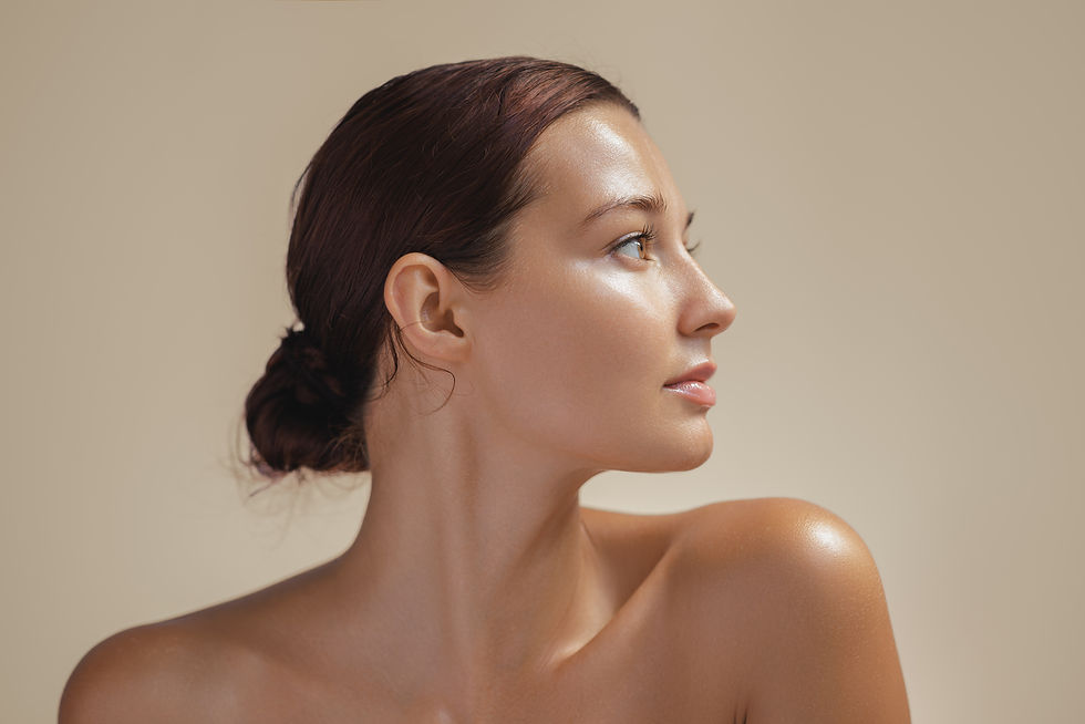 Side view portrait of a young woman with glowing, healthy skin in soft light Ideal for bea