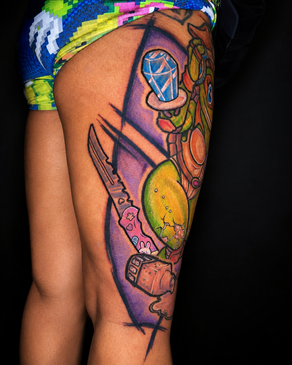 Colorful Ninja Turtle tattoo on a person's thigh.