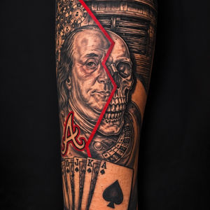 Benjamin Franklin skull tattoo with playing cards
