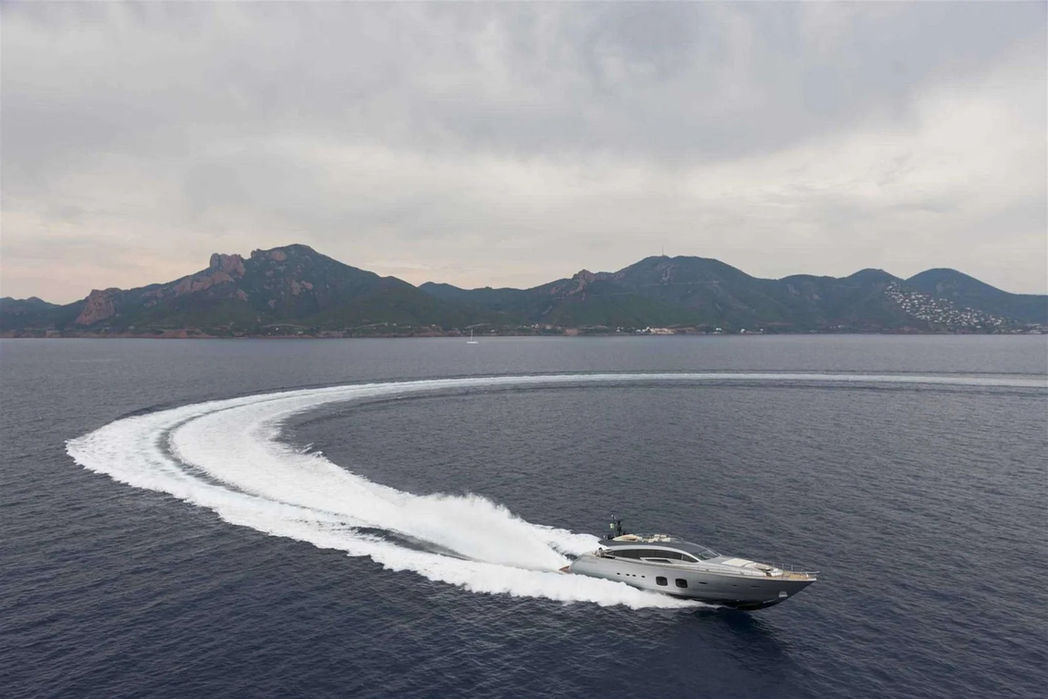 Stylish Pershing 108 yacht making a high-speed turn along the French Riviera.