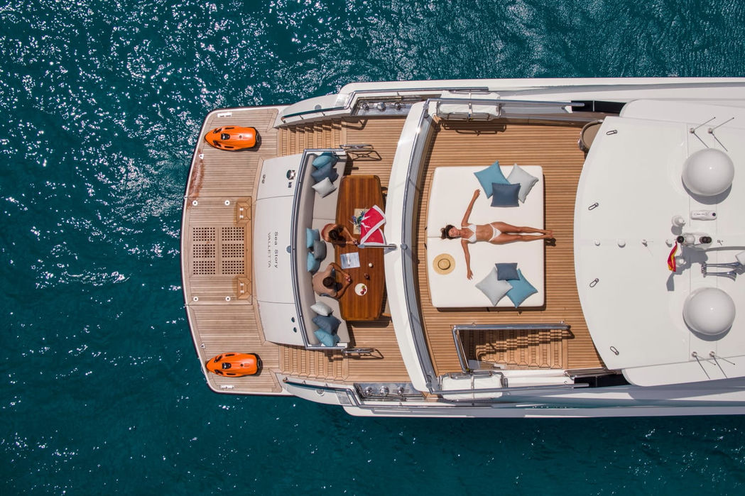 Aerial deck view of Sea Story yacht showing lounging and dining spaces