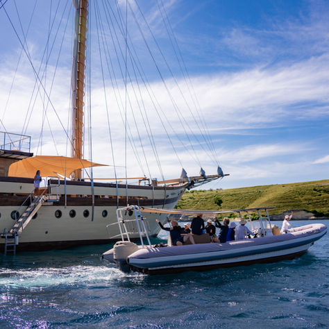 Comparison between a luxury yacht charter and a resort stay in Raja Ampat