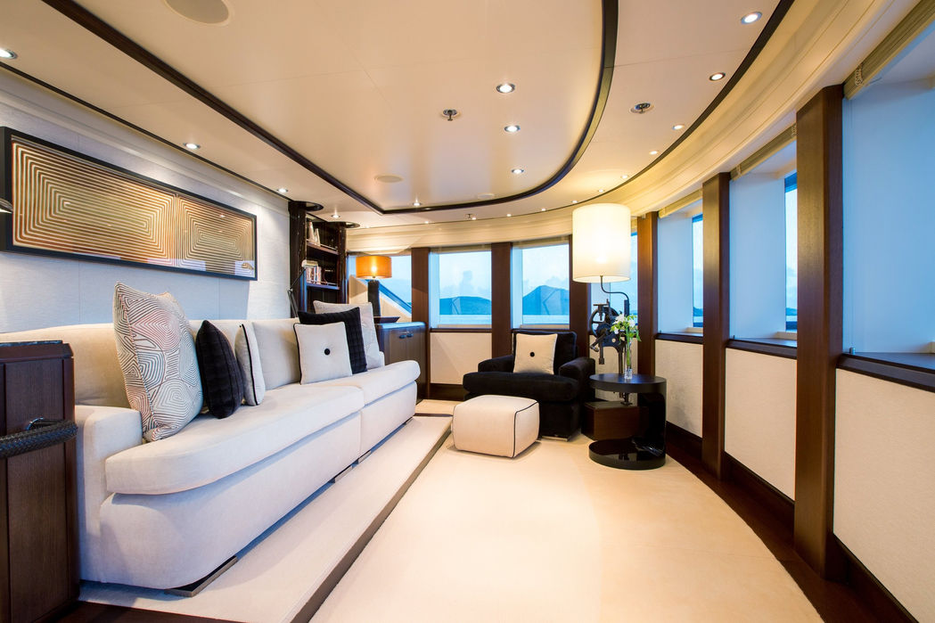 Twin guest cabin with modern decor and ocean-view windows on Slipstream