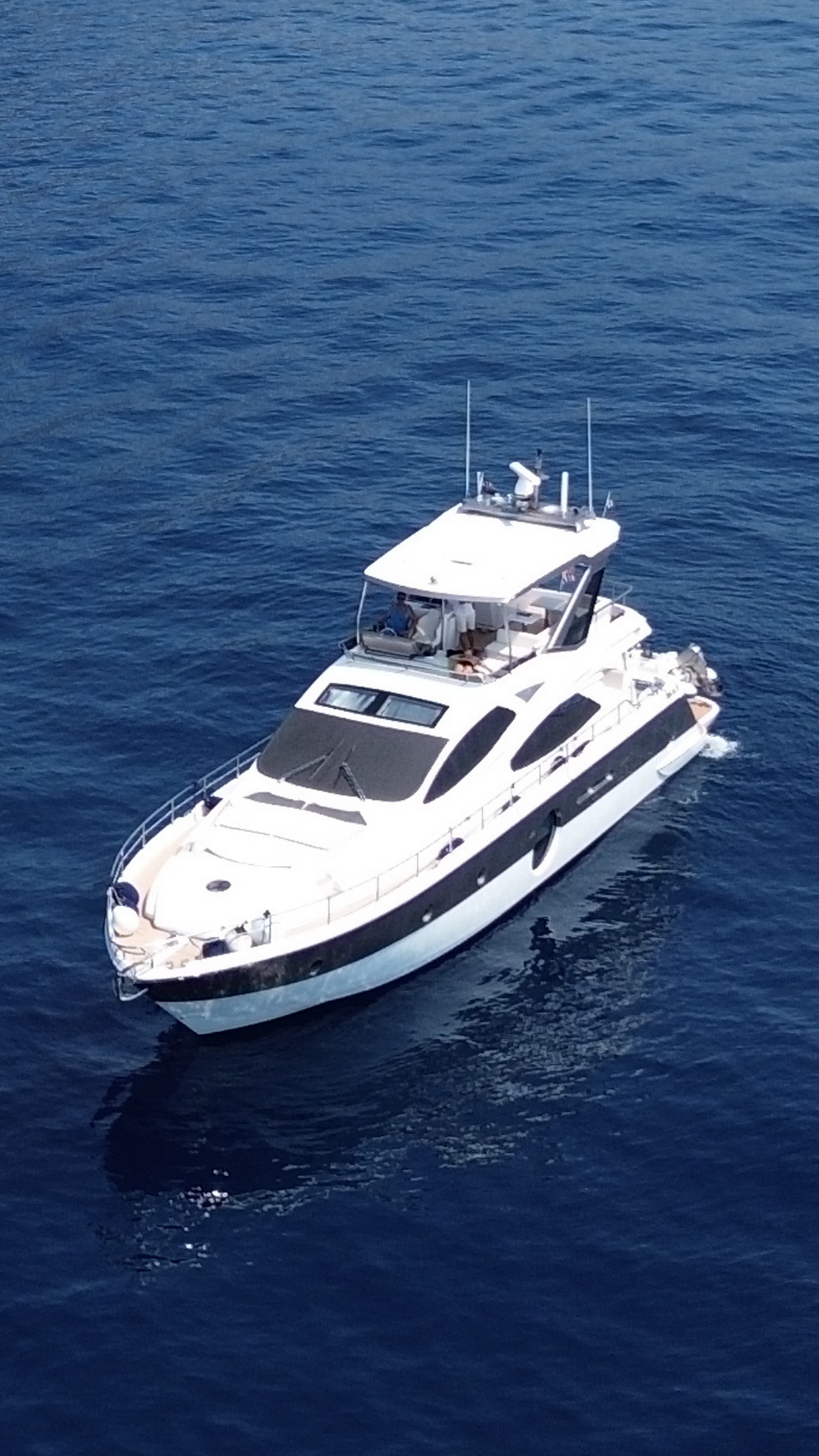 Aicon 64 luxury motor yacht cruising on the French Riviera during a private day charter with Navélia Yacht Charters