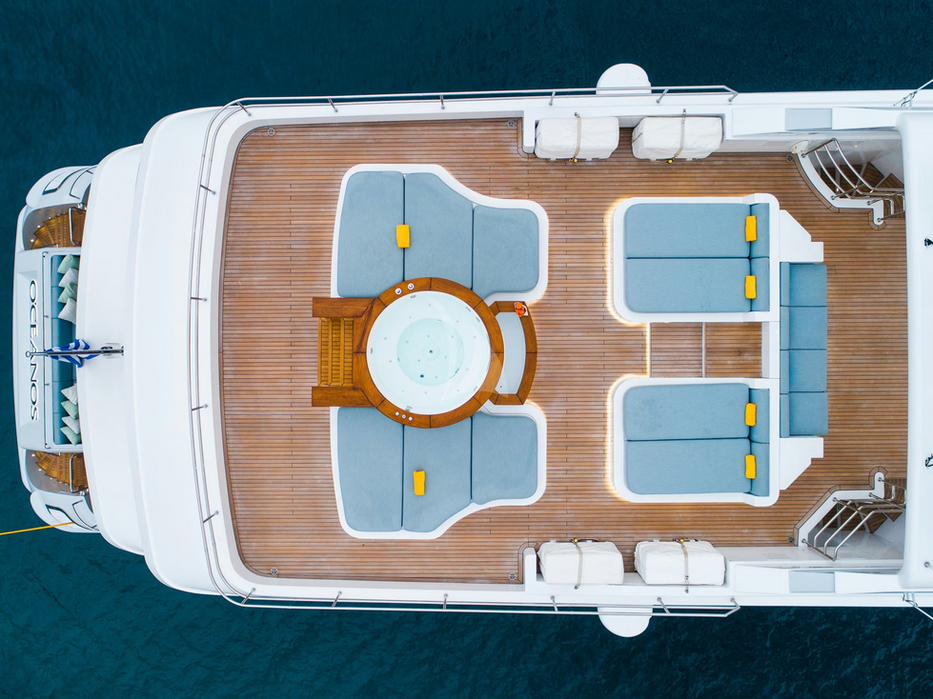 Top-down deck blueprint of Oceanos superyacht showing lounges, jacuzzi, and dining areas for French Riviera charters.