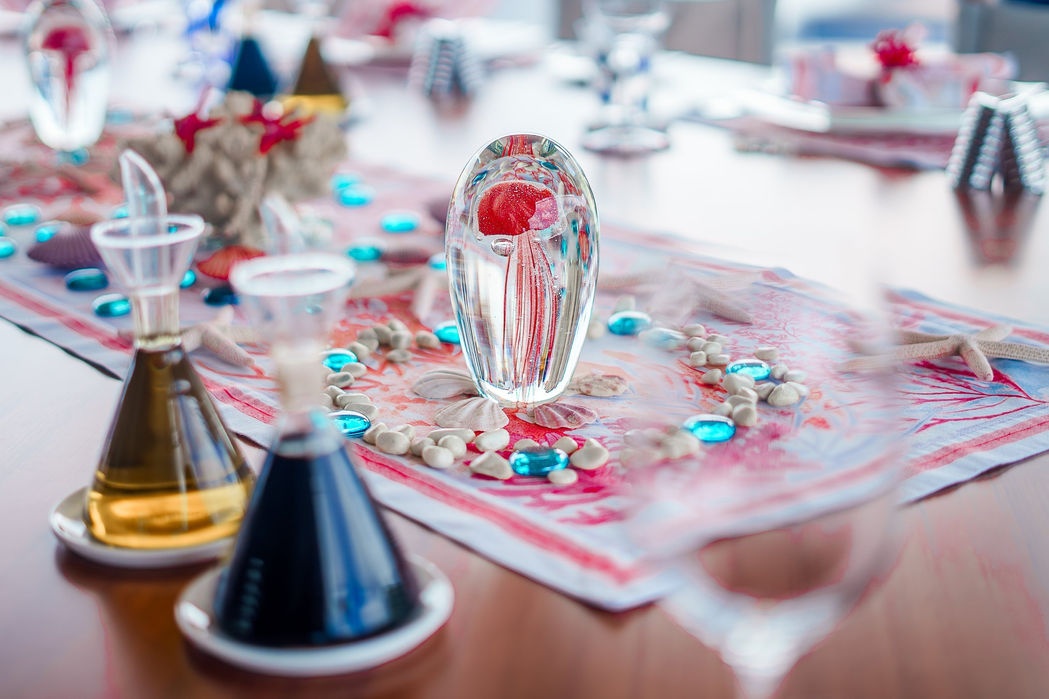 Luxury dining presentation aboard a sailing superyacht.