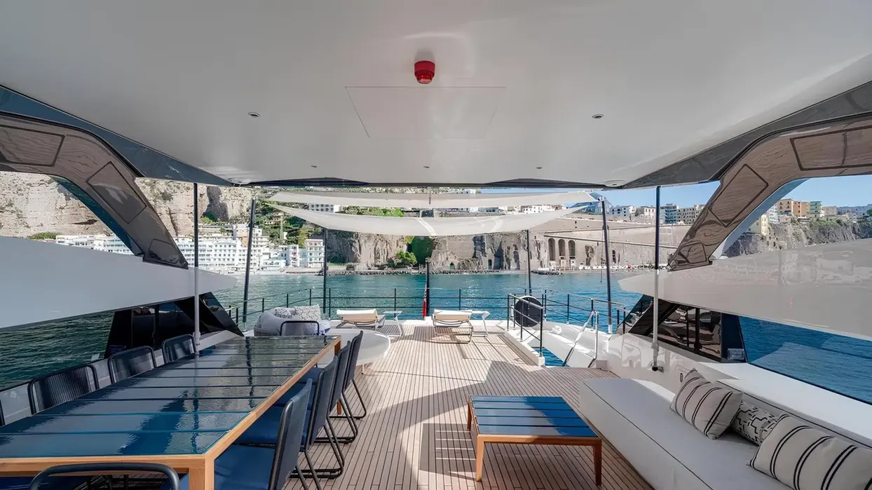 Alfresco dining area on the aft deck of Marican Forever with sea views.