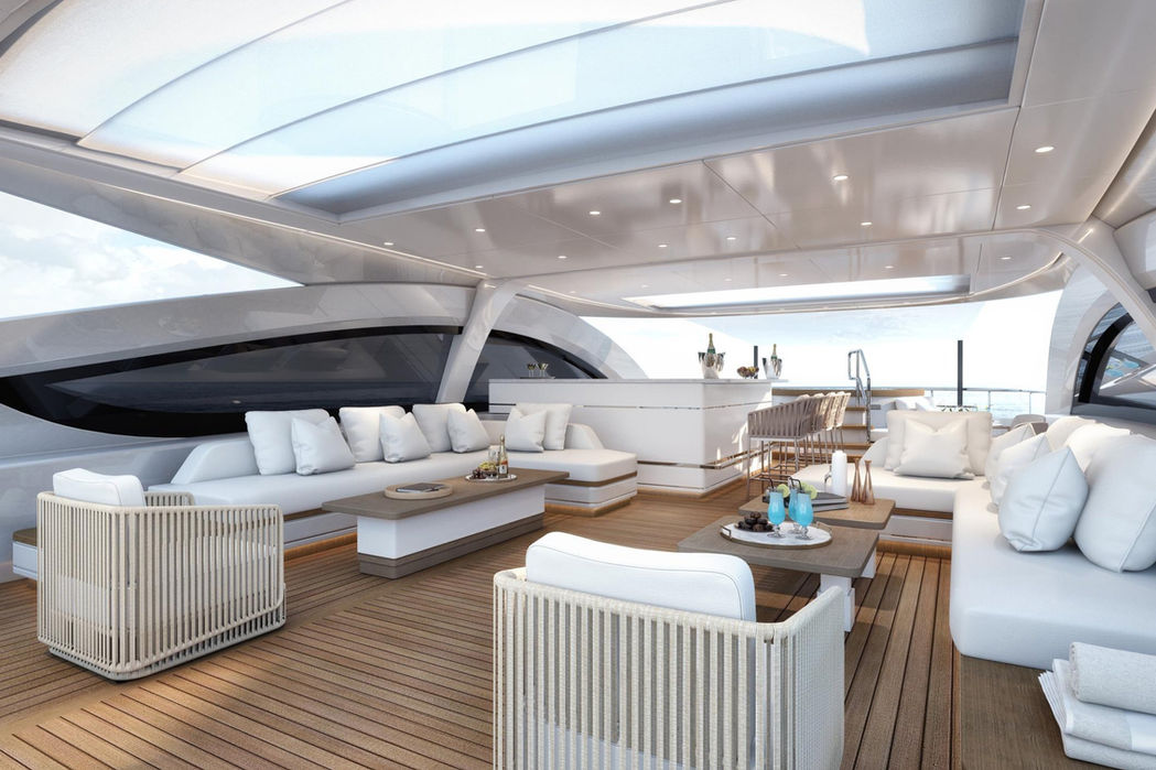 Luxury yacht XWave main salon with wraparound windows at sunset