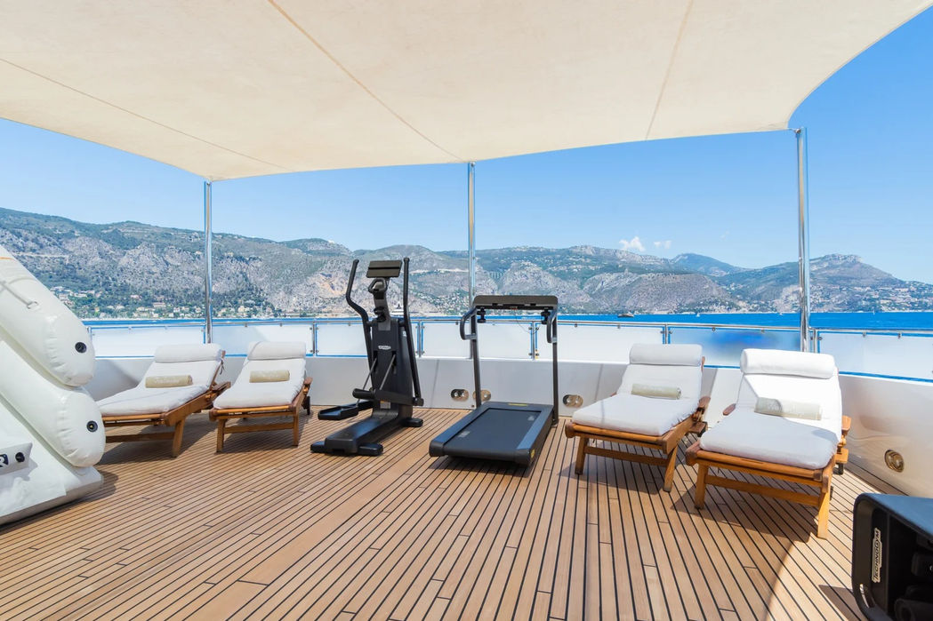 Sun loungers on The Wellesley’s deck facing the open sea.